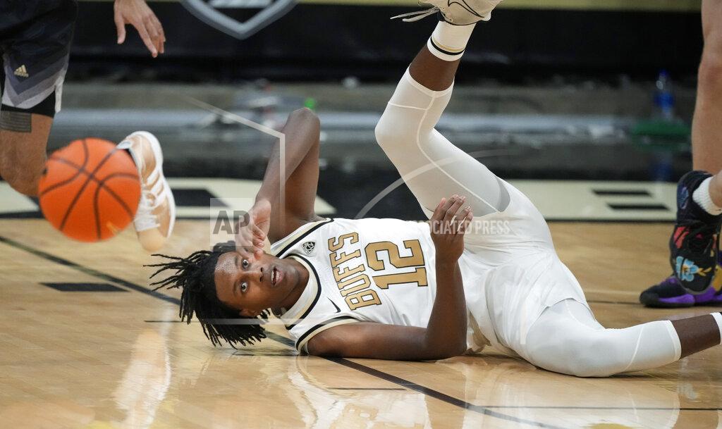 David Zalubowski Colorado forward Jabari Walker hits the floor while trying to corral the ball in the first first half of an NCAA college basketball game against Washington, Sunday, Jan. 9, 2022, in Boulder, Colo. (AP Photo/David Zalubowski)