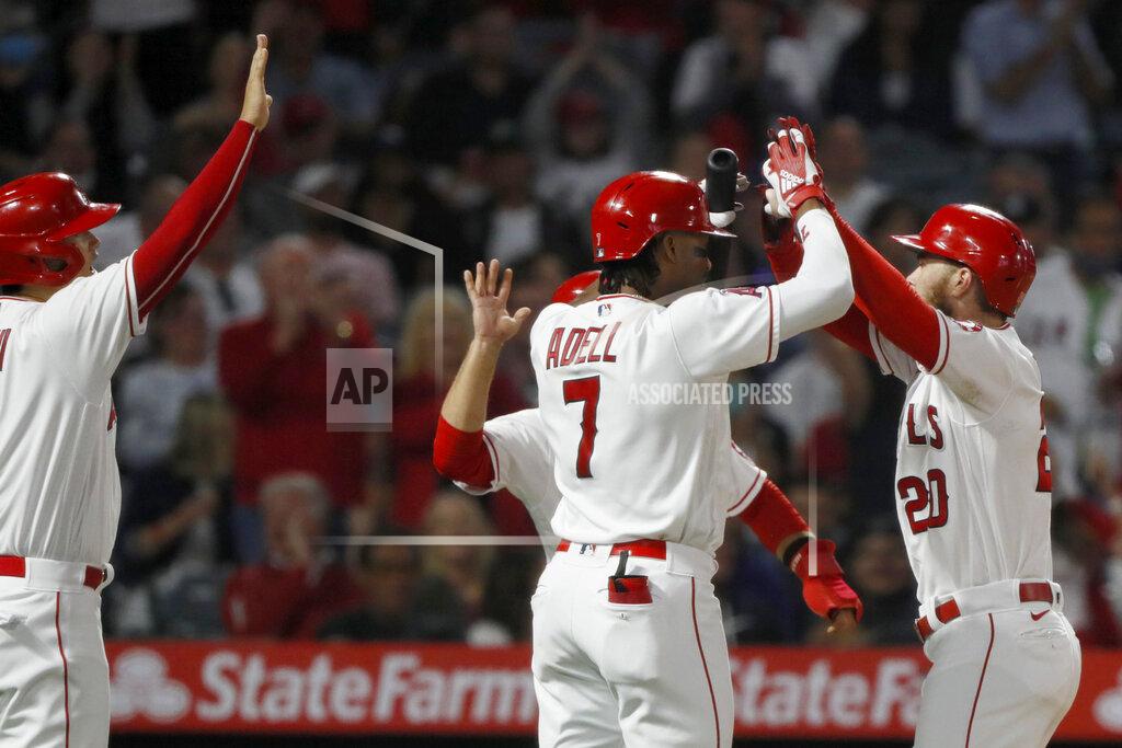 Alex Gallardo Los Angeles Angels' Jared Walsh, right, gets congratulations at the plate from Jo Adell (7) and Shohei Ohtani, left, after Walsh hits a three-run home run against the New York Yankees during the fourth inning of a baseball game in Anaheim, Calif., Tuesday, Aug. 31, 2021. (AP Photo/Alex Gallardo)