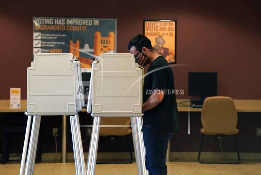 Rich Pedroncelli FILE — In this Tuesday Sept. 14, 2021 file photo a voter marks his recall ballot at the Sacramento County Registrar of Voters Office in Sacramento, Calif. California Republicans needed a heroic turnout in Tuesday's recall election to have any chance of ousting Democratic Gov. Gavin Newsom, but preliminary vote tallies, Friday Sept. 17, 2021, show overall turnout in the state was around 55%, far below the 80% that voted in the 2020 presidential contest. (AP Photo/Rich Pedroncelli, File)