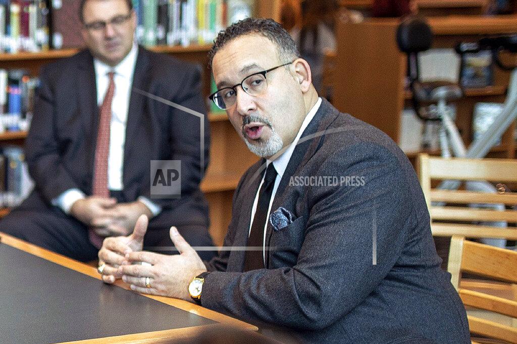 Devin Leith-Yessian FILE - In this Jan. 28, 2020 file photo, Connecticut State Commissioner of Education Miguel Cardona speaks with Berlin High School students while on a tour of the school. President-elect Joe Biden has chosen the education commissioner for Connecticut and a former public school teacher to serve as education secretary. (Devin Leith-Yessian/Berlin Citizen/Record-Journal via AP)