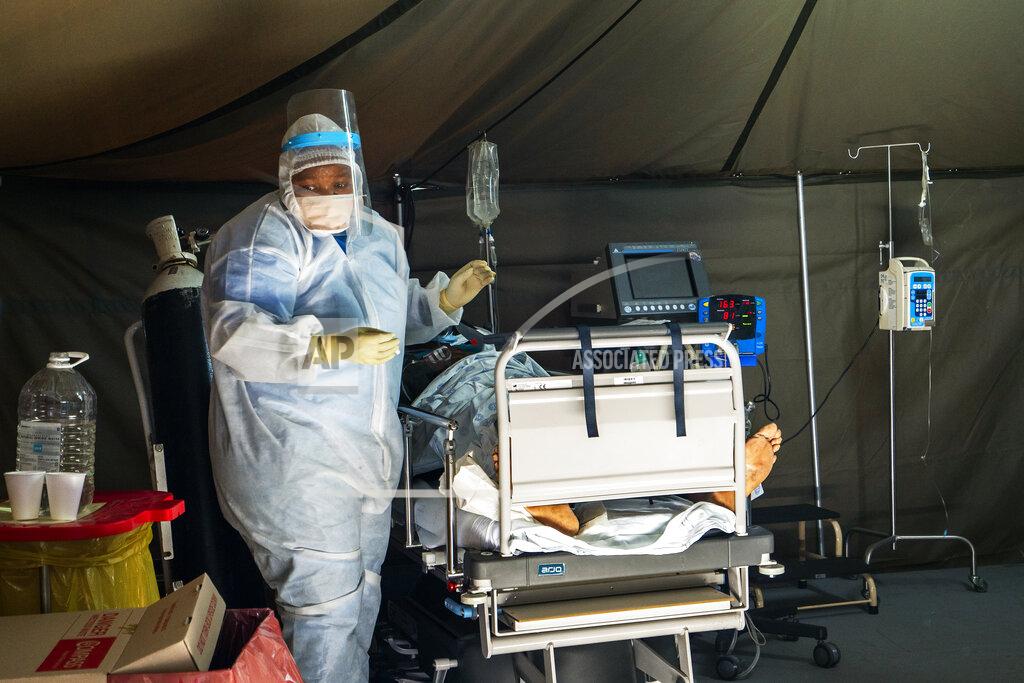Jerome Delay Covid-19 patients are being treated at the Tshwane District Hospital in Pretoria, South Africa, Friday July 10, 2020. Health Minister Zweli Mkhize this week said South Africa could run out of available hospital beds within the month. "The storm that we have consistently warned South Africans about is now arriving," he told lawmakers. The African continent overall has over 523,000 confirmed virus cases after passing the half-million milestone on Wednesday. But shortages in testing materials mean the true number is unknown.(AP Photo/Jerome Delay)
