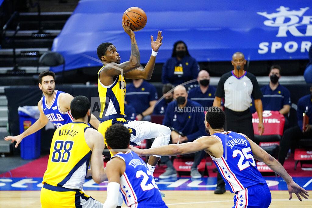Matt Slocum Indiana Pacers' Edmond Sumner, center, goes up for a shot during the first half of an NBA basketball game against the Philadelphia 76ers, Monday, March 1, 2021, in Philadelphia. (AP Photo/Matt Slocum)