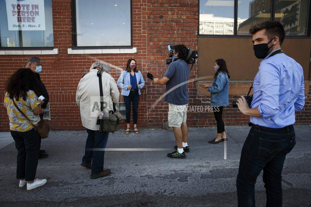 Brian Powers Theresa Greenfield does interviews after dropping off her ballot at the Polk County Election office on Tuesday, Oct. 13, 2020, in Des Moines. Greenfield is challenging Republican Senator Joni Ernst in the November election. (Brian Powers/The Des Moines Register via AP )