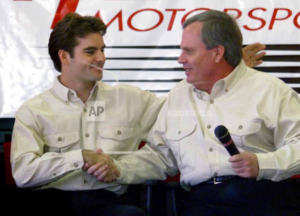 Chuck Burton FILE - Driver Jeff Gordon, left, shakes hands with team owner Rick Hendrick during a news conference to announce a long-erm agreement in Harrisburg, N.C., in this Wednesday Oct. 6, 1999, file photo. Jeff Gordon will leave the Fox Sports booth for a daily role at Hendrick Motorsports as vice chairman ranked second only to majority owner Rick Hendrick. The new job positions the four-time champion and Hall of Famer to eventually succeed Hendrick at the top of NASCAR’s winningest organization. (AP Photo/Chuck Burton, File)
