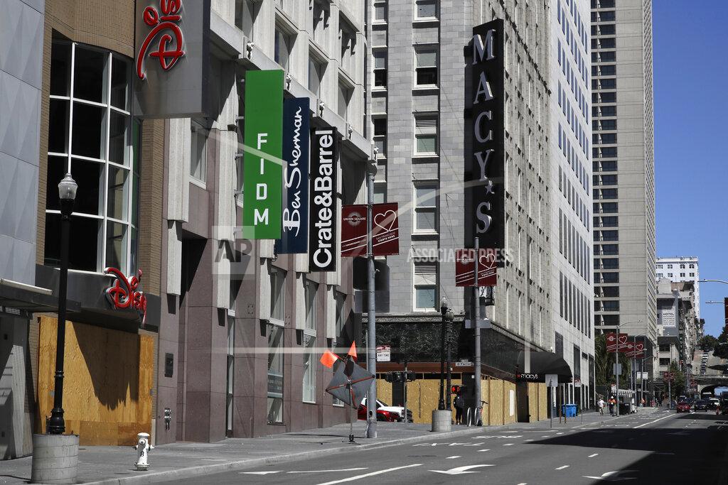 Ben Margot Closed businesses are seen Wednesday, May 27, 2020, in downtown San Francisco. While much of California moves swiftly to reopen things like hair salons under Gov. Gavin Newsom's guidance, the San Francisco Bay Area is continuing to keep the brakes on. Some health officials are questioning whether the state is taking enough time to assess the effects of reopening things like stores before jumping ahead to broader re-openings, risking a surge in infections. (AP Photo/Ben Margot)