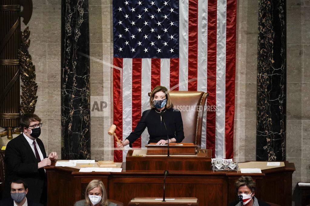 J. Scott Applewhite Speaker of the House Nancy Pelosi, D-Calif., gavels in the final vote of the impeachment of President Donald Trump, for his role in inciting an angry mob to storm the Congress last week, at the Capitol in Washington, Wednesday, Jan. 13, 2021. (AP Photo/J. Scott Applewhite)