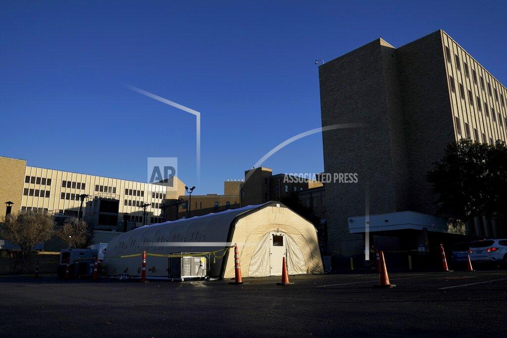 A portable, overflow, intensive care unit, that is currently not being used, is seen located behind Hendrick Medical Center on Wednesday, Dec. 16, 2020, in Abilene, Texas. (AP Photo/Tony Gutierrez)