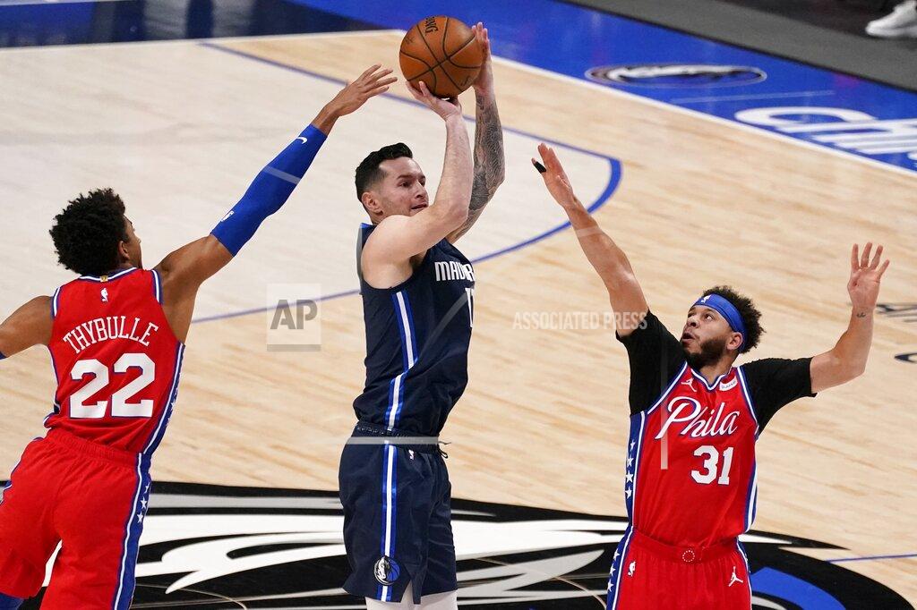 Tony Gutierrez Philadelphia 76ers guard Matisse Thybulle (22) and guard Seth Curry (31) defend against a shot by Dallas Mavericks guard JJ Redick, center, in the first half of an NBA basketball game in Dallas, Monday, April 12, 2021. (AP Photo/Tony Gutierrez)