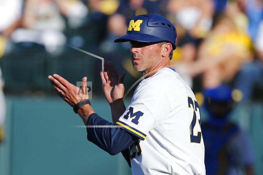 Ringo H.w. Chiu FILE - In this June 8, 2019, file photo, Michigan head coach Erik Bakich gestures during an NCAA college baseball tournament super regional game against UCLA in Los Angeles. A group of Power Five coaches led by Michigan’s Erik Bakich is proposing a later start to the college baseball season to trim expenses in the post-coronavirus era, make the game more fan friendly and reduce injury risk to players. (AP Photo/Ringo H.W. Chiu, File)