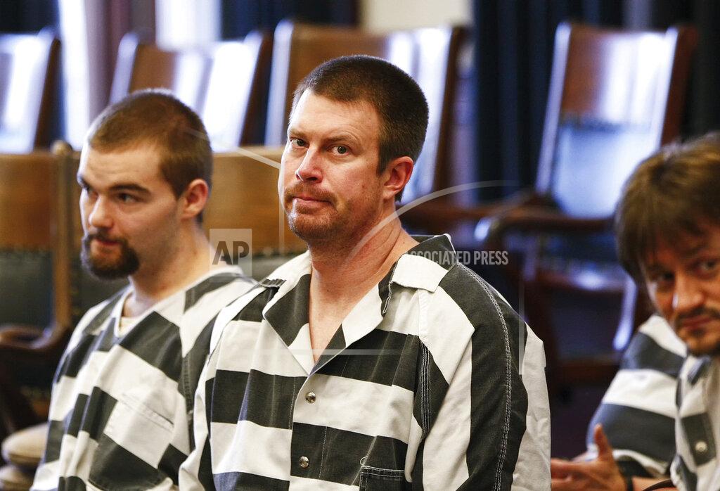 Larry Beckner FILE - In this May 8, 2012, file photo, Ryan Leaf, center, sits in a Cascade County courtroom in Great Falls, Mont. Ryan Leaf spent most of his time in prison alone and angry until a military veteran persuaded the former No. 2 overall NFL draft pick to stop self-loathing long enough to help fellow inmates learn to read. Now the once-star quarterback who is widely considered the biggest bust in league history is helping former players adapt to retirement and trying to make sure they cope far better than he did. (Larry Beckner/The Great Falls Tribune via AP, File)