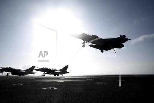 FILE - A Rafale fighter jet lands on deck of the French aircraft carrier Charles de Gaulle, off the coast of the city of Hyeyres, southern France, Thursday, Jan. 23, 2020. Croatia’s government on Wednesday Nov. 24, 2021, approved the purchase of 12 Rafale fighter jets from France worth about 1 billion euros ($ 1.2 billion) to replace its aging fleet of Soviet-era aircraft and strengthen its air force amid lingering tensions in the Balkans. (Philippe Lopez/Pool Photo via AP, File)