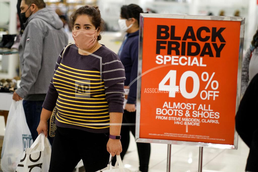 Ringo H.w. Chiu A Black Friday shopper wearing a face mask shops at the Glendale Galleria in Glendale, Calif., Friday, Nov. 27, 2020. (AP Photo/Ringo H.W. Chiu)
