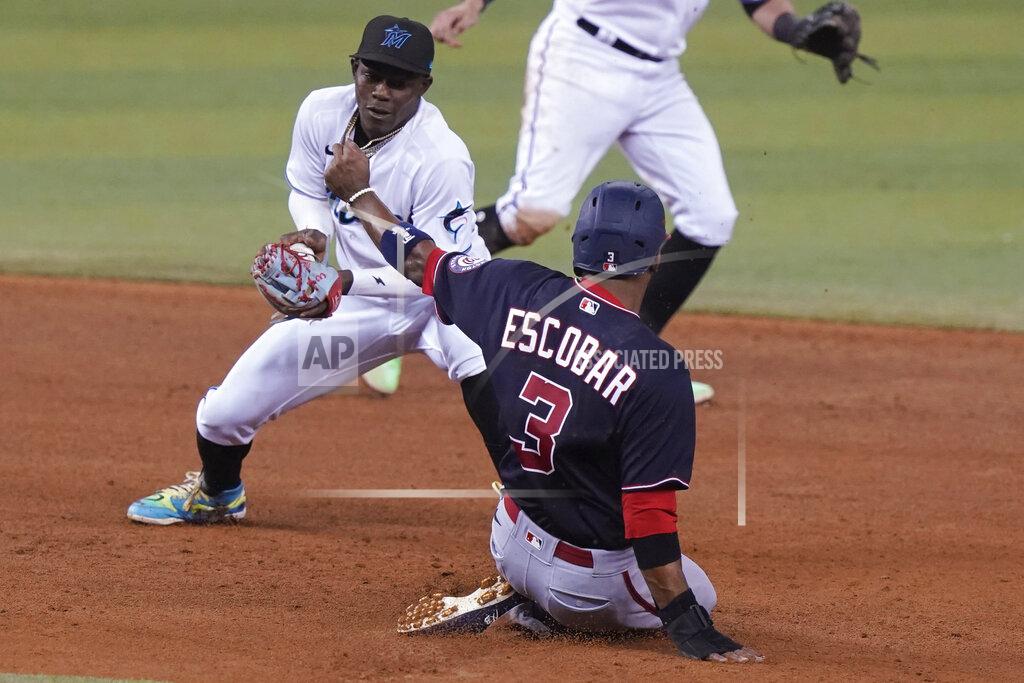 Marta Lavandier Washington Nationals' Alcides Escobar (3) is safe on second as Miami Marlins second baseman Jazz Chisholm Jr. is late with the tag during the sixth of a baseball game, Tuesday, Sept. 21, 2021, in Miami. (AP Photo/Marta Lavandier)