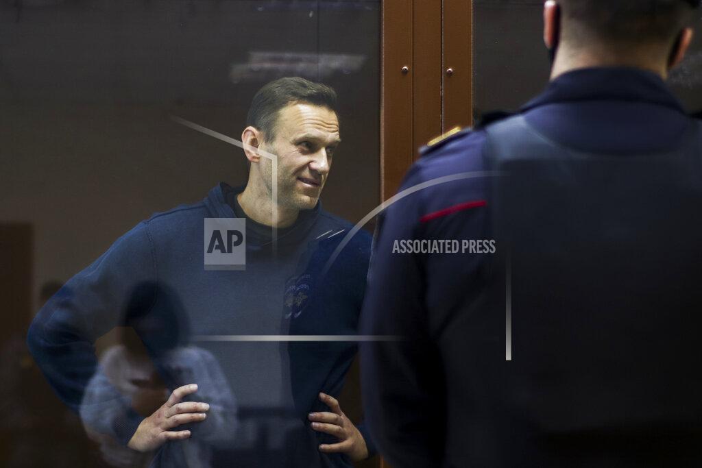 Uncredited In this photo provided by the Babuskinsky District Court, Russian opposition leader Alexei Navalny stands in a cage during a hearing on his charges for defamation, in the Babuskinsky District Court in Moscow, Russia, Friday, Feb. 5, 2021. Russian opposition leader Alexei Navalny appeared in a Moscow court on Friday for the second time this week, this time on a charge of slandering a World War II veteran. The politician, who was ordered earlier this week to serve two years and eight months in prison, slammed the hearing as a "disgusting PR trial" intended by the Kremlin to disparage him. (Babuskinsky District Court Press Service via AP)