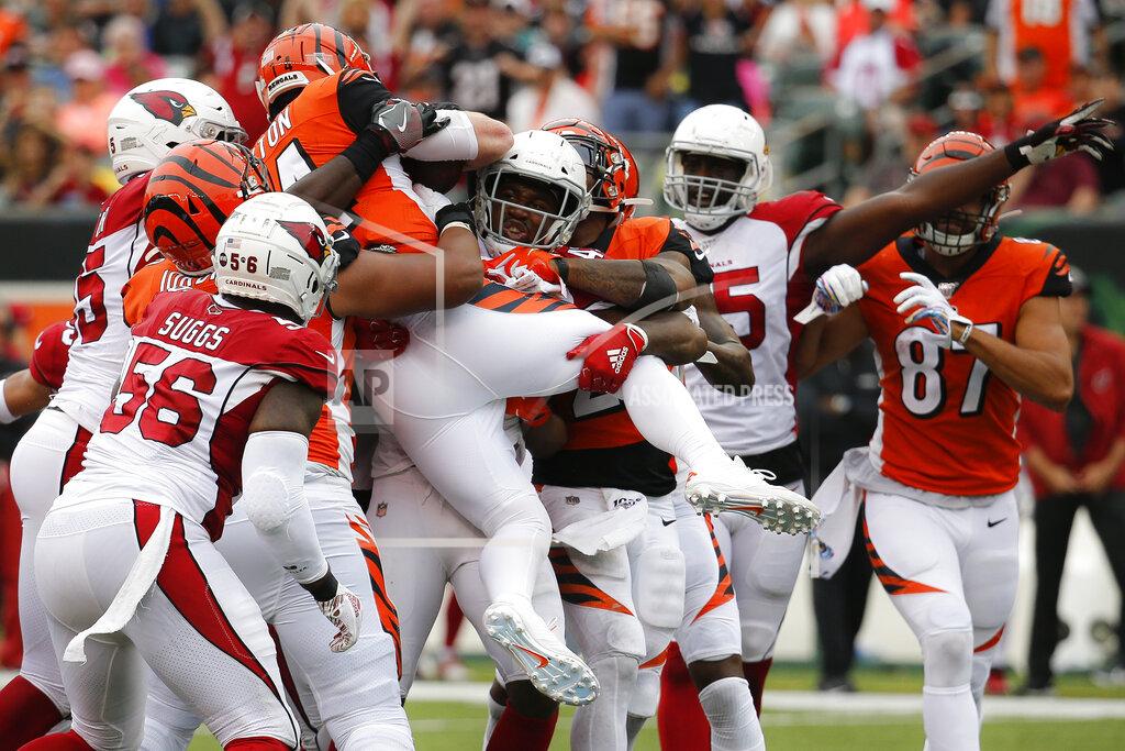 Frank Victores Cincinnati Bengals quarterback Andy Dalton (14) is stopped mid-air on a running play in the second half of an NFL football game against the Arizona Cardinals, Sunday, Oct. 6, 2019, in Cincinnati. (AP Photo/Frank Victores)