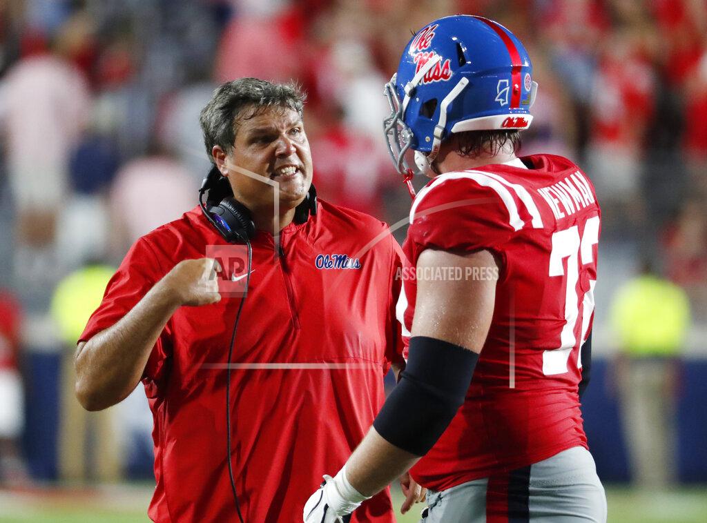 Rogelio V. Solis Mississippi coach Matt Luke confers with offensive lineman Royce Newman (72) during the second half of an NCAA college football game against Arkansas, Saturday, Sept. 7, 2019, in Oxford, Miss. Mississippi won 31-17. (AP Photo/Rogelio V. Solis)