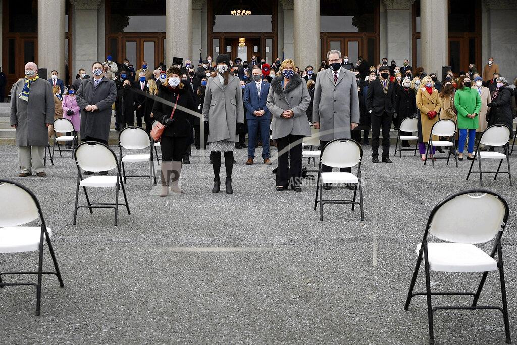 Jessica Hill Members of the Connecticut House of Representatives stand for a photo after taking the oath of office outside on the State Capitol grounds, Wednesday, Jan. 6, 2021, in Hartford, Conn. The new legislative session is expected to focus on the continuing coronavirus pandemic and the state's budget challenges. (AP Photo/Jessica Hill)
