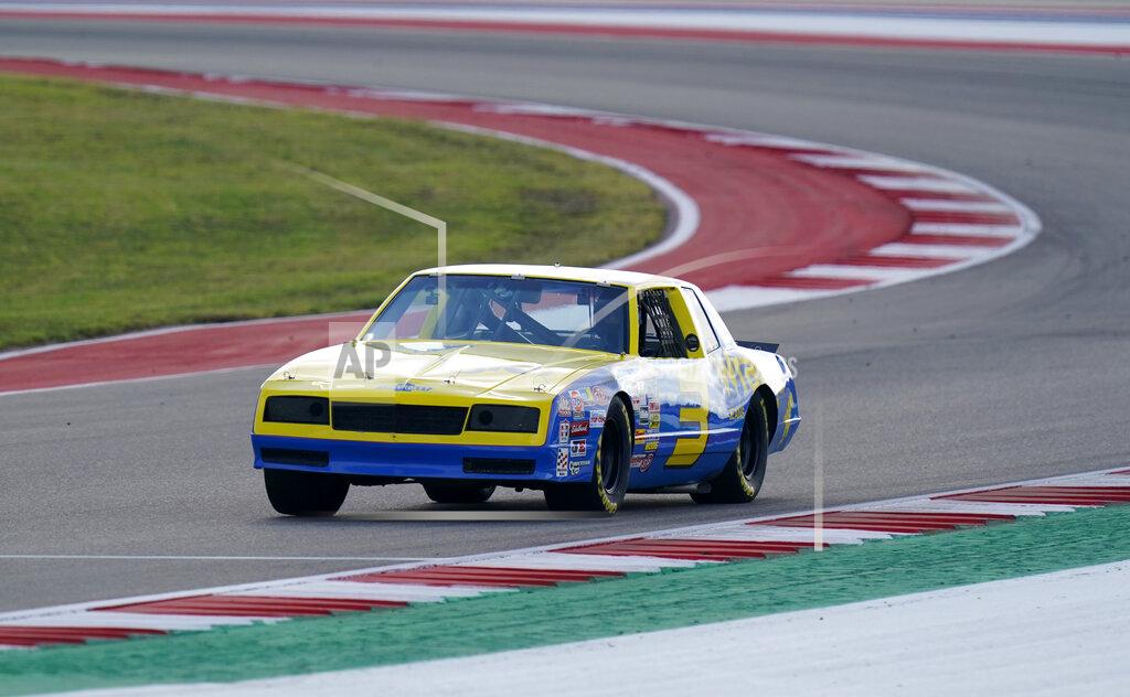 Eric Gay McLaren driver Daniel Ricciardo, of Australia, drives the late NASCAR driver Dale Earnhardt's iconic 1984 No. 3 Wrangler Chevrolet Monte Carlo before an open practice for the Formula One U.S. Grand Prix auto race at the Circuit of the Americas, Saturday, Oct. 23, 2021, in Austin, Texas. Ricciardo was allowed to drive the car as a reward from his McLaren boss, Zak Brown, for winning his first race with the team. (AP Photo/Eric Gay)