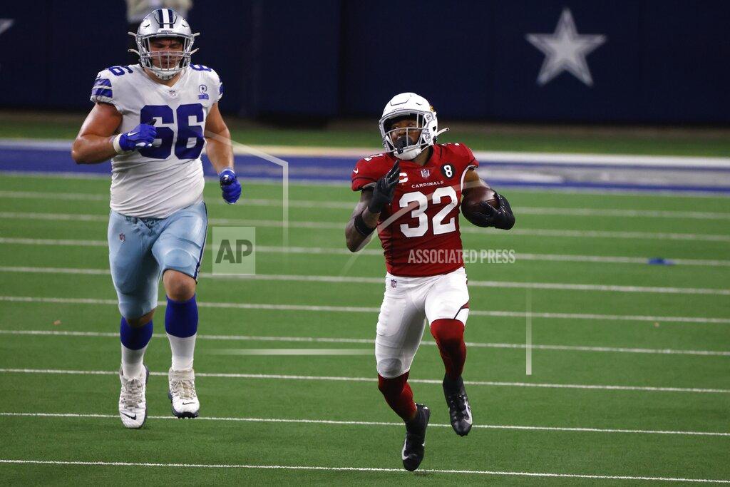 Ron Jenkins Dallas Cowboys guard Connor McGovern (66) gives chase as Arizona Cardinals' Budda Baker (32) returns an Andy Dalton (14) interception in the second half of an NFL football game in Arlington, Texas, Monday, Oct. 19, 2020. (AP Photo/Ron Jenkins)