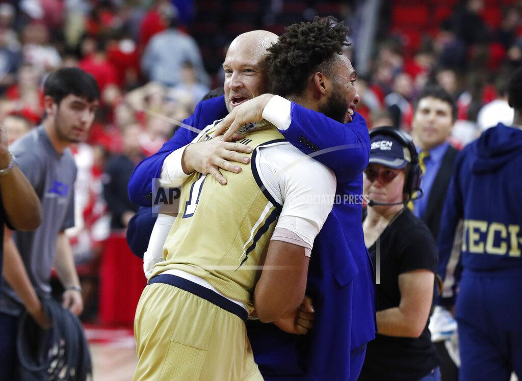 Ethan Hyman Georgia Tech assistant coach Julian Swartz hugs James Banks III (1) after Georgia Tech's 82-81 overtime victory over North Carolina State in an NCAA college basketball game Tuesday, Nov. 5, 2019, in Raleigh, N.C. (Ethan Hyman/The News & Observer via AP)