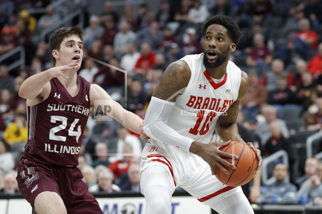 Jeff Roberson Bradley's Elijah Childs (10) heads to the basket as Southern Illinois' Trent Brown (24) defends during the first half of an NCAA college basketball game in the quarterfinal round of the Missouri Valley Conference men's tournament Friday, March 6, 2020, in St. Louis. (AP Photo/Jeff Roberson)