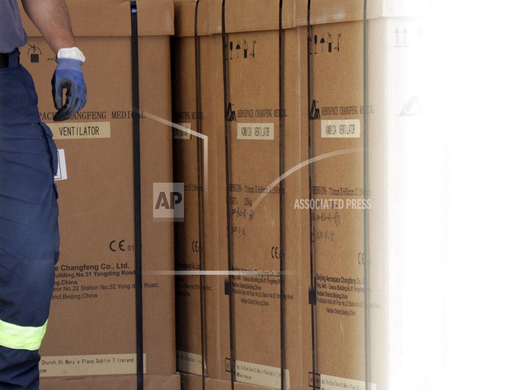 Civil protection workers move boxes of ventilators at the customs post in the Bosnia capital Sarajevo, Thursday, April 30, 2020. In their initial report, the Bosnian state prosecutors said in a statement released Monday May 11, 2020, that the ventilators imported from China by private company Silver Raspberry, and paid for by the country’s government, have been found to be useless for COVID-19 coronavirus patients. (AP Photo)