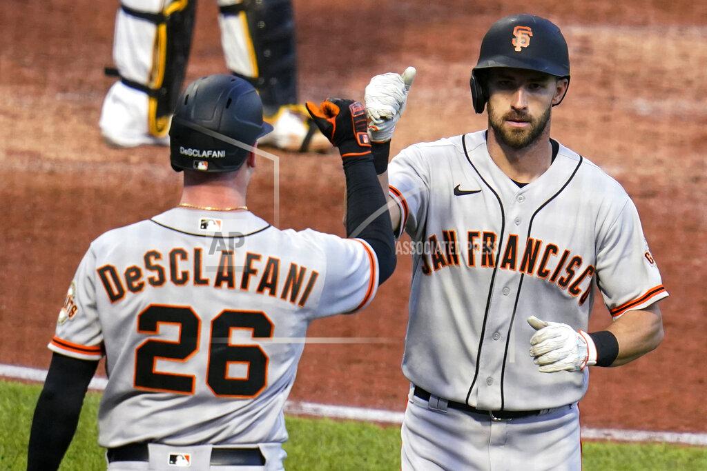 Gene J. Puskar San Francisco Giants' Steven Duggar, right, is greeted by Anthony DeSclafani as he returns to the dugout after hitting a solo home run off Pittsburgh Pirates starting pitcher Wil Crowe during the fifth inning of a baseball game in Pittsburgh, Thursday, May 13, 2021.(AP Photo/Gene J. Puskar)