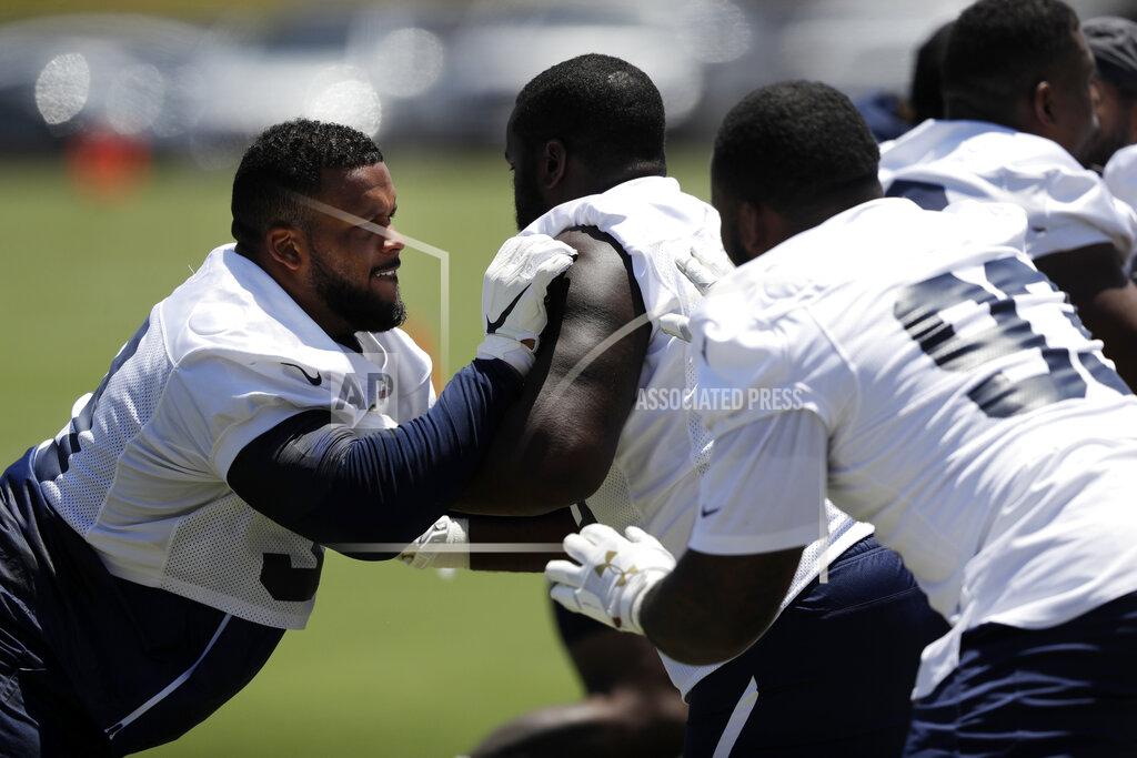 Marcio Jose Sanchez Los Angeles Rams defensive linemen including Aaron Donald, left, go through drills during an NFL football training camp Tuesday, May 28, 2019, in Thousand Oaks, Calif. (AP Photo/Marcio Jose Sanchez)