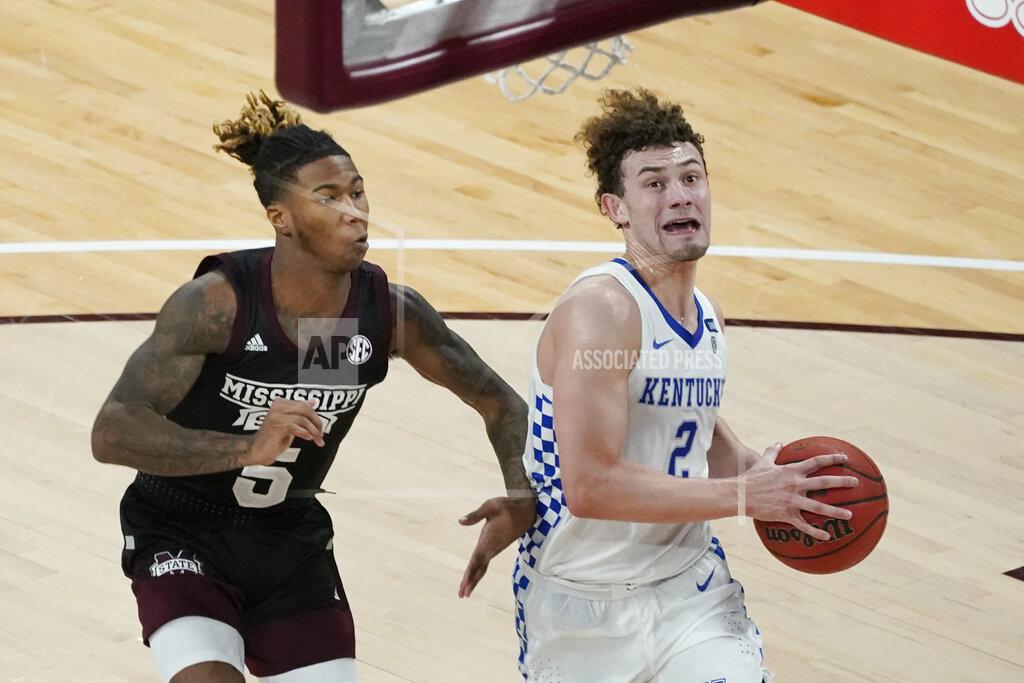Rogelio V. Solis Kentucky guard Devin Askew (2) runs past Mississippi State guard Deivon Smith (5) to attempt a layup during the second half of an NCAA college basketball game in Starkville, Miss., Saturday, Jan. 2, 2021. (AP Photo/Rogelio V. Solis)