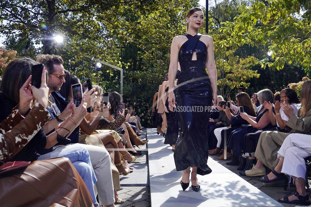 Richard Drew The Michael Kors Spring/Summer 2022 collection is modeled during Fashion Week in New York, Friday, Sept. 10, 2021. (AP Photo/Richard Drew)
