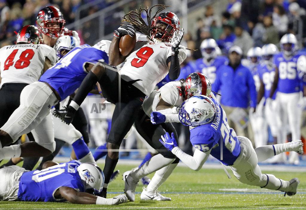 Mark Humphrey Western Kentucky wide receiver Xavier Lane (9) is brought down in the first half of an NCAA college football game against Middle Tennessee Friday, Nov. 2, 2018, in Murfreesboro, Tenn. (AP Photo/Mark Humphrey)