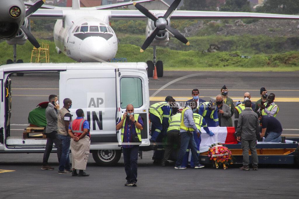 Justin Kabumba The coffins of Italian ambassador to Congo Luca Attanasio and Carabinieri officer Vittorio Iacovacci, draped with the Italian flag, are prepared to be loaded onto an airplane for repatriation to Italy, at the airport in Goma, North Kivu province, Congo Tuesday, Feb. 23, 2021. An Italian Carabinieri unit is expected in Congo Tuesday to investigate the killings of the Italian ambassador to Congo, an Italian Carabinieri police officer and their driver in the country's east. (AP Photo/Justin Kabumba)
