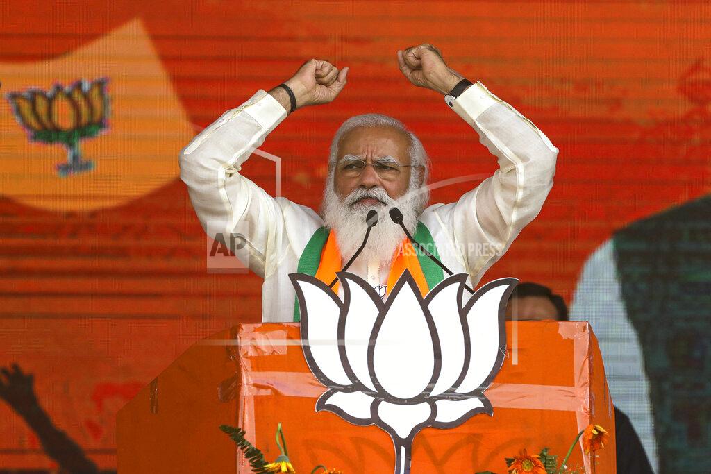 Bikas Das FILE - In this March 7, 2021, file photo, Indian Prime Minister Narendra Modi addresses a public rally ahead of West Bengal state elections in Kolkata, India. As coronavirus deaths mount and a vaccine rollout falters badly, the crisis has badly dented Modi’s carefully cultivated image as an able technocrat. (AP Photo/Bikas Das, File)