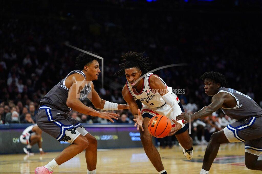 Frank Franklin Ii Connecticut's Isaiah Whaley, center, drives past Seton Hall's Jared Rhoden, left, and Kadary Richmond, right, during the first half of an NCAA college basketball game at the Big East conference tournament Thursday, March 10, 2022, in New York. (AP Photo/Frank Franklin II)