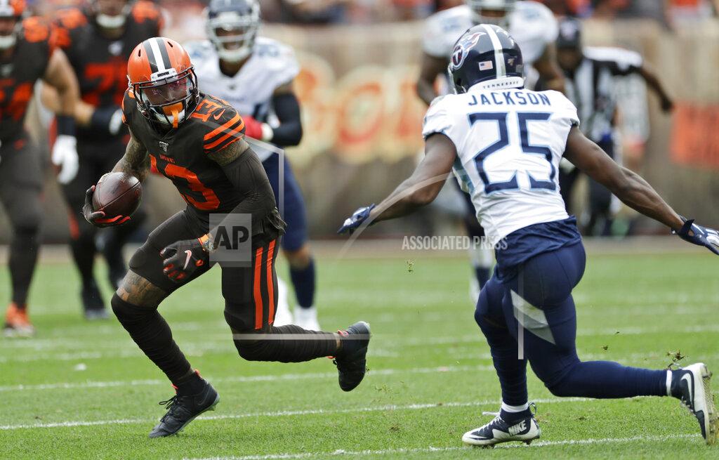 Ron Schwane Cleveland Browns wide receiver Odell Beckham Jr. (13) avoids Tennessee Titans cornerback Adoree' Jackson (25) during the first half in an NFL football game Sunday, Sept. 8, 2019, in Cleveland. (AP Photo/Ron Schwane)