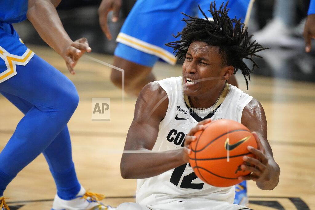 David Zalubowski Colorado forward Jabari Walker pulls in a loose ball during the first half of the team's NCAA college basketball game against UCLA on Saturday, Jan. 22, 2022, in Boulder, Colo. (AP Photo/David Zalubowski)