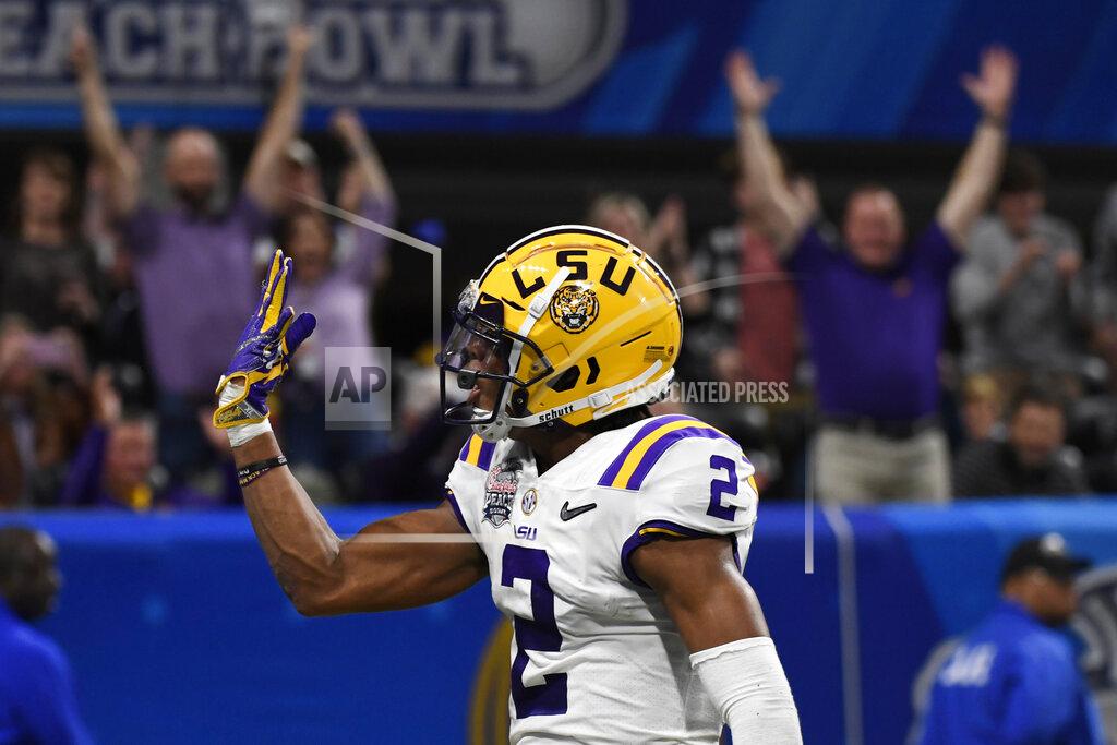 Danny Karnik LSU wide receiver Justin Jefferson (2) celebrates a touchdown catch against Oklahoma safety Justin Broiles (25) during the first half of the Peach Bowl NCAA semifinal college football playoff game, Saturday, Dec. 28, 2019, in Atlanta. (AP Photo/Danny Karnik)