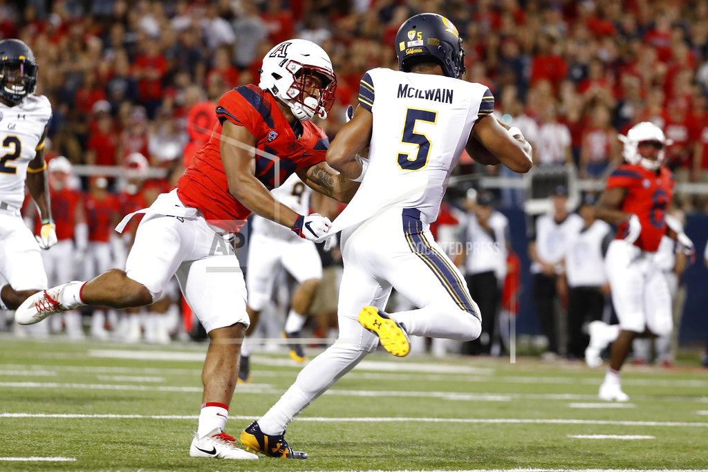 Chris Coduto California quarterback Brandon McIlwain (5) scores a 25-yard touchdown while being defended by Arizona safety Scottie Young Jr. (19) during the first half of an NCAA college football game Saturday, Oct. 6, 2018, in Tucson, Ariz. (AP Photo/Chris Coduto)