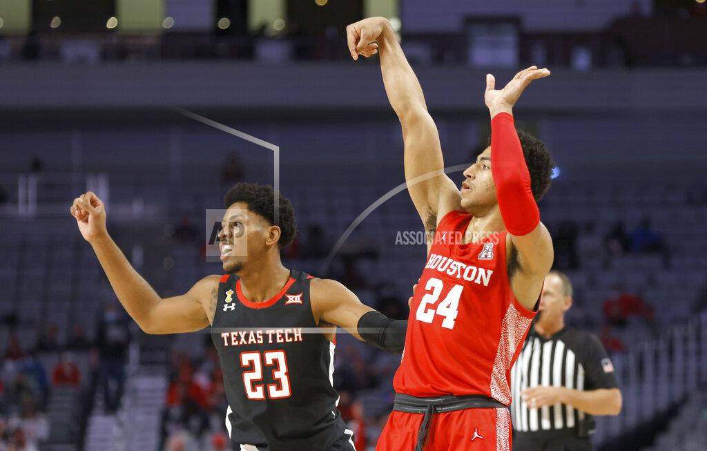 Ron Jenkins Houston guard Quentin Grimes (24) watches his three-point shot-attempt as Texas Tech guard Chibuzo Agbo (23) looks on during the second half of an NCAA college basketball game, Sunday, Nov. 29, 2020, in Fort Worth, Texas. (AP Photo/Ron Jenkins)