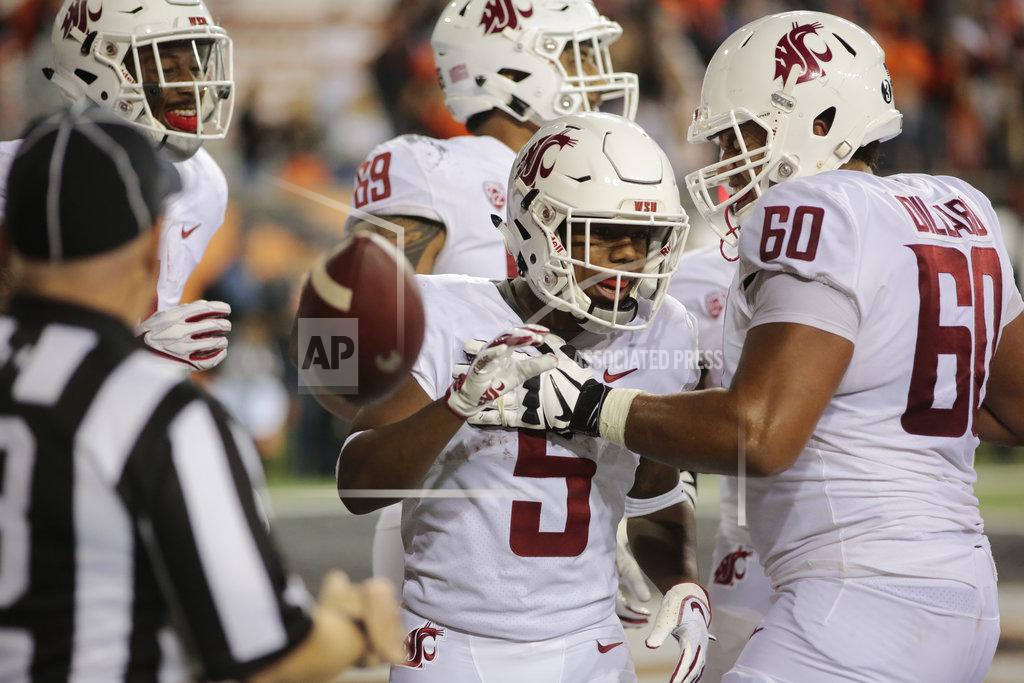 Timothy J. Gonzalez Washington State's Travell Harris (5) celebrates with teammate Andre Dillard (60) after making a touchdown during the fourth quarter of an NCAA college football against Oregon State in Corvallis, Ore., Saturday, Oct. 6, 2018. (AP Photo/Timothy J. Gonzalez)