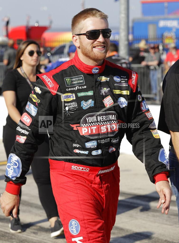 Chuck Burton Chris Buescher walks down pit road before qualifying for Saturday's NASCAR All-Star Cup series auto race at Charlotte Motor Speedway in Concord, N.C., Friday, May 17, 2019. (AP Photo/Chuck Burton)