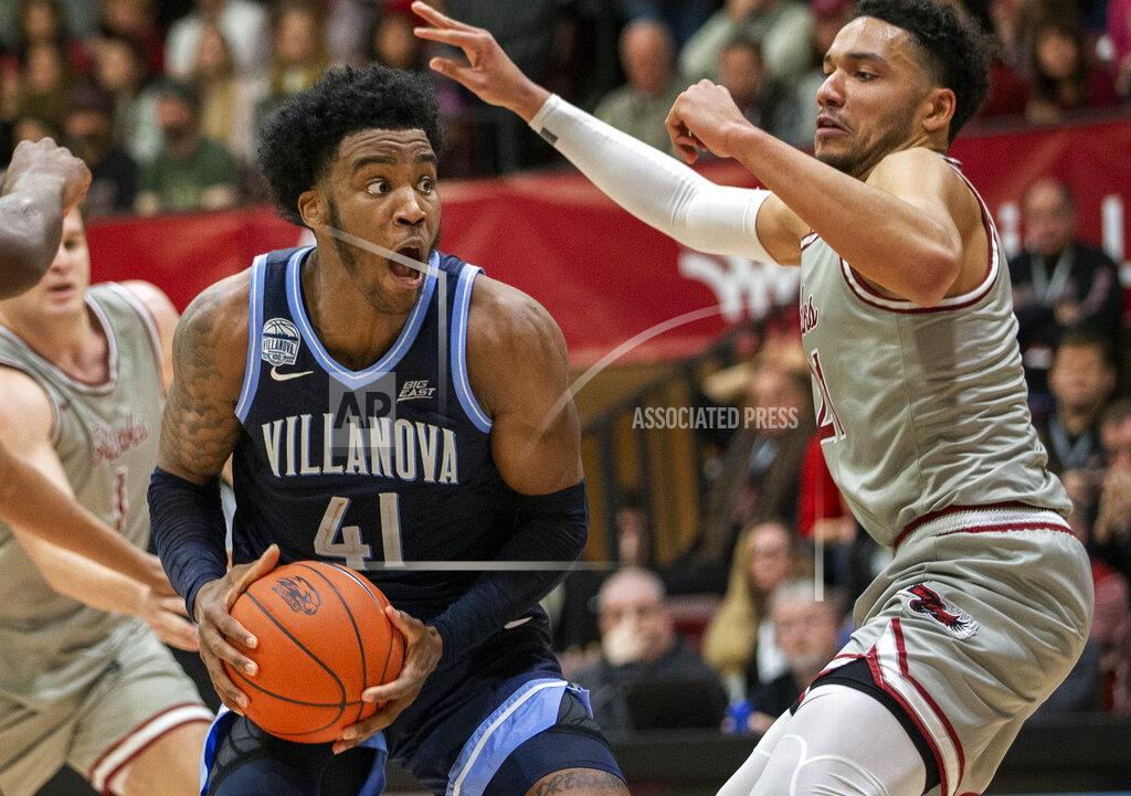 Laurence Kesterson Villanova forward Saddiq Bey (41) moves around Saint Joseph's forward Lorenzo Edwards (21) during the second half of an NCAA college basketball game, Saturday, Dec. 7, 2019, in Philadelphia. Villanova won 78-66. (AP Photo/Laurence Kesterson)
