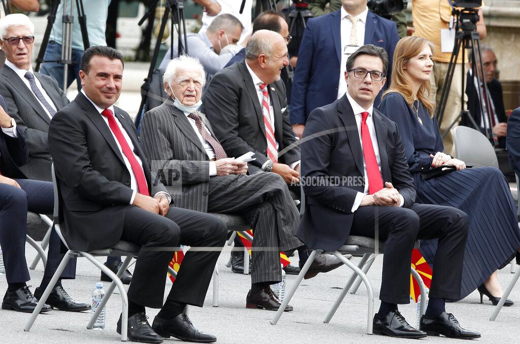 Boris Grdanoski North Macedonia's Prime Minister Zoran Zaev, left, and the President Stevo Pendarovski, right, look on during the parade as a part of the Independence Day ceremony in downtown Skopje, North Macedonia, Wednesday, Sept. 8, 2021. North Macedonia is celebrating Wednesday the 30th anniversary since its independence from former Yugoslavia. (AP Photo/Boris Grdanoski)