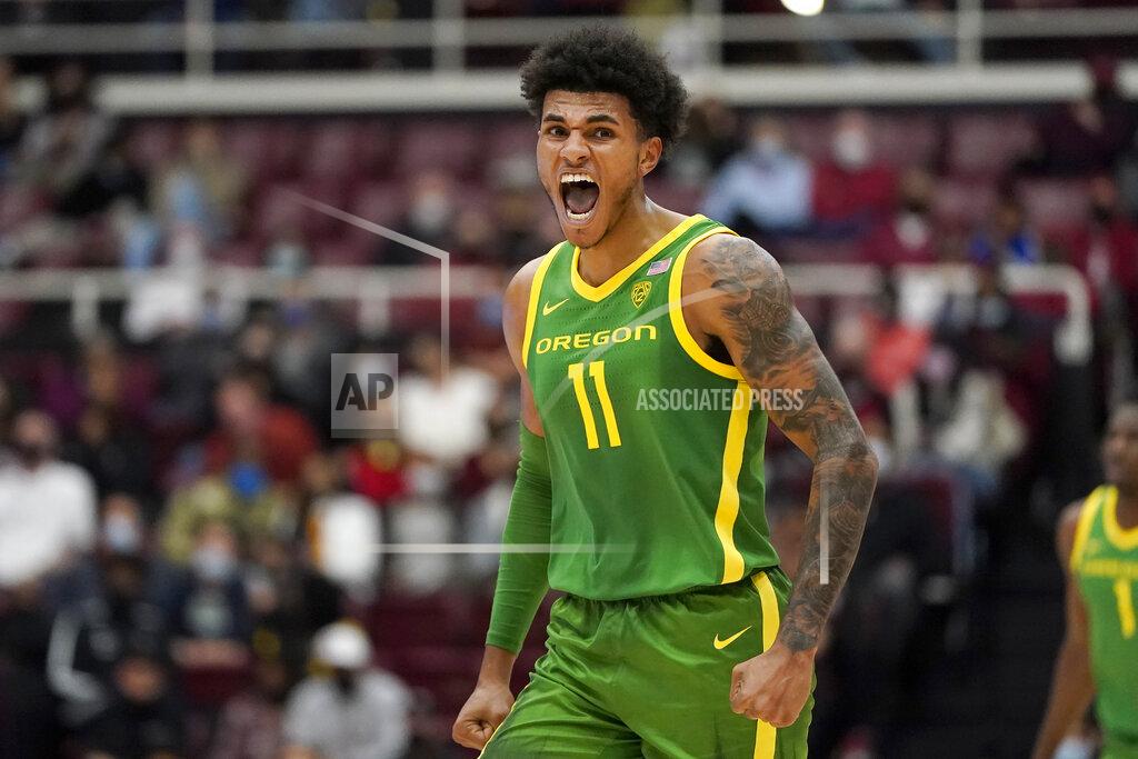 Jeff Chiu Oregon guard Rivaldo Soares (11) celebrates after a teammate scored against Stanford during the second half of an NCAA college basketball game in Stanford, Calif., Sunday, Dec. 12, 2021. (AP Photo/Jeff Chiu)