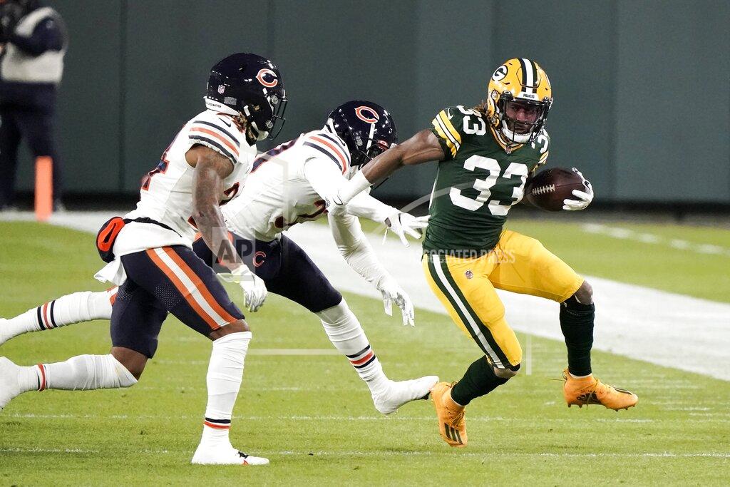 Morry Gash Green Bay Packers' Aaron Jones runs during the first half of an NFL football game against the Chicago Bears Sunday, Nov. 29, 2020, in Green Bay, Wis. (AP Photo/Morry Gash)