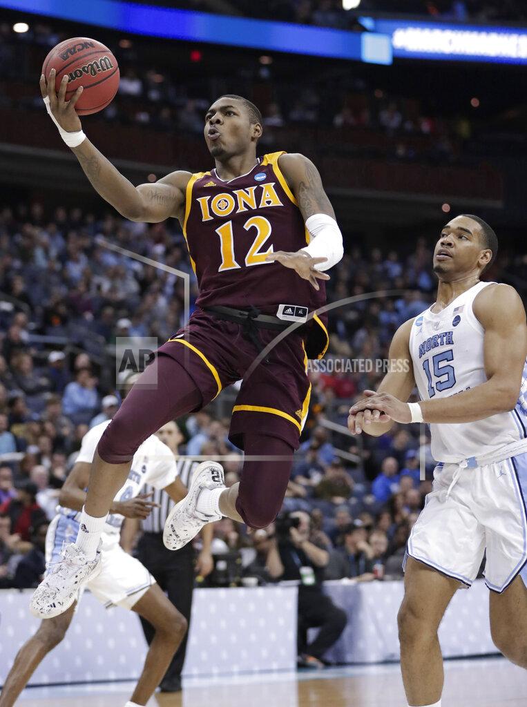 Tony Dejak Iona's Tajuan Agee (12) drives to the basket against North Carolina's Garrison Brooks (15) during the second half of a first-round game in the NCAA men’s college basketball tournament in Columbus, Ohio, Friday, March 22, 2019. North Carolina won 88-73. (AP Photo/Tony Dejak)