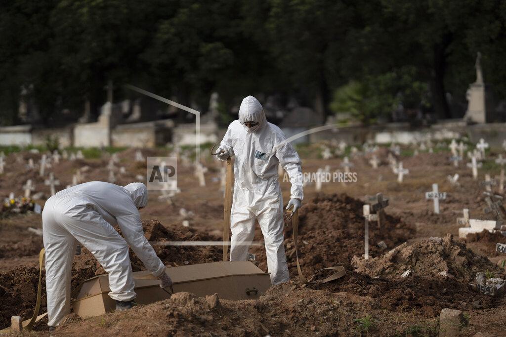 Leo Correa Cemetery workers in protective clothing maneuver the coffin of 57-year-old Paulo Jose da Silva, who died from the new coronavirus, in Rio de Janeiro, Brazil, Friday, June 5, 2020. According to Monique dos Santos, her stepfather mocked the existence of the virus, didn't use a mask, didn't take care of himself, and wanted to shake hands with everybody. "He didn't believe in it and unfortunately he met this end. It's very sad, but that's the truth," she said. (AP Photo/Leo Correa)