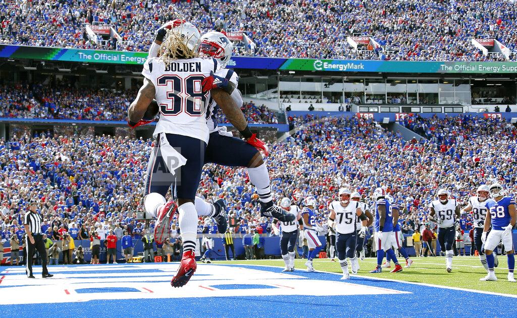 Ron Schwane New England Patriots running back Brandon Bolden celebrates his touchdown run against the Buffalo Bills with James White, rear, in the first half of an NFL football game, Sunday, Sept. 29, 2019, in Orchard Park, N.Y. (AP Photo/Ron Schwane)