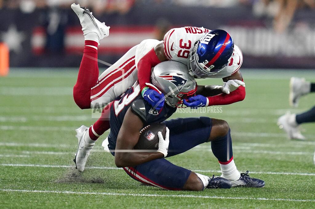 Charles Krupa New York Giants safety Trenton Thompson (39) brings down New England Patriots wide receiver Lil'Jordan Humphrey (83) during the second half of a preseason NFL football game Thursday, Aug. 11, 2022, in Foxborough, Mass. (AP Photo/Charles Krupa)