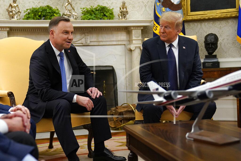 Evan Vucci President Donald Trump meets with Polish President Andrzej Duda in the Oval Office of the White House, Wednesday, June 24, 2020, in Washington. (AP Photo/Evan Vucci)